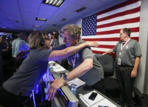 Marla Thornton, left, celebrates with Steve Levin in Mission Control at NASA's Jet Propulsion Laboratory as the solar-powered Juno spacecraft goes into orbit around Jupiter on Monday, July 4, 2016, in Pasadena, Calif. (ANSA/AP Photo/Ringo H.W. Chiu, Pool)
